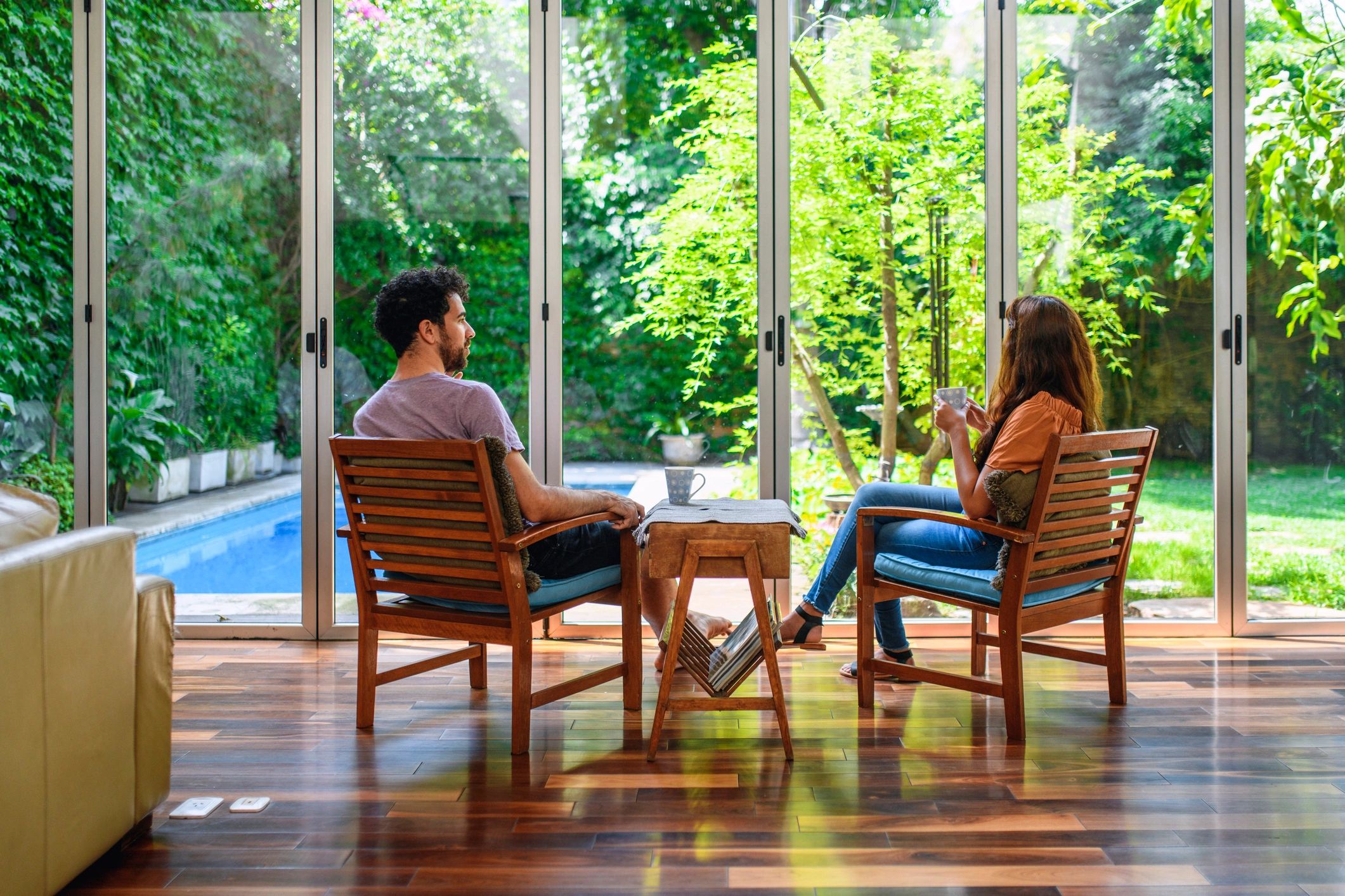 Couple enjoying coffee in a quiet, naturally lit sitting area