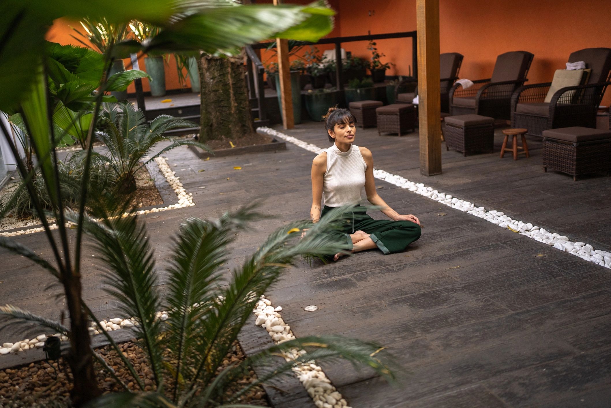 Woman meditating in a serene spa setting