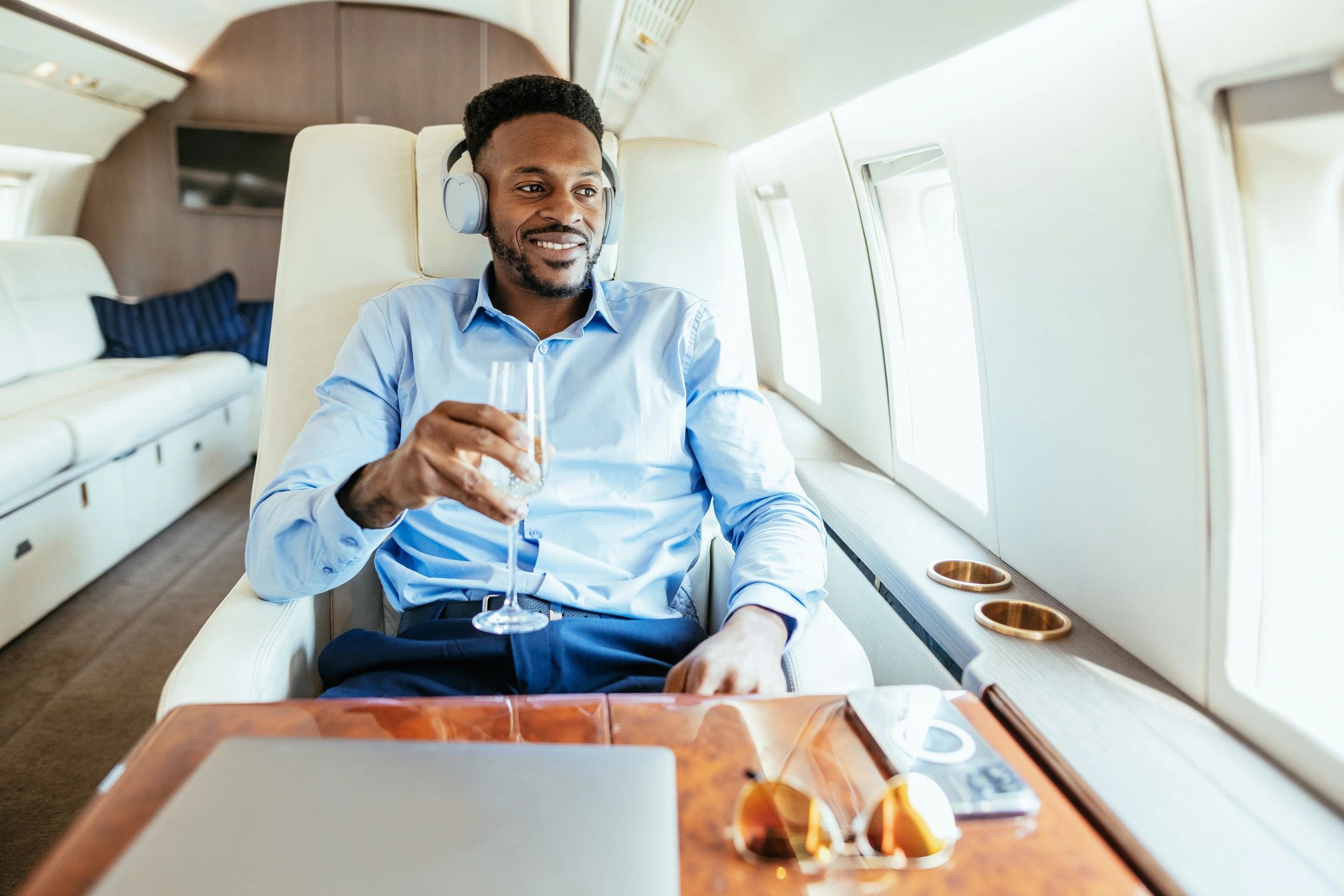 Client looking out a private jet window while planning travel