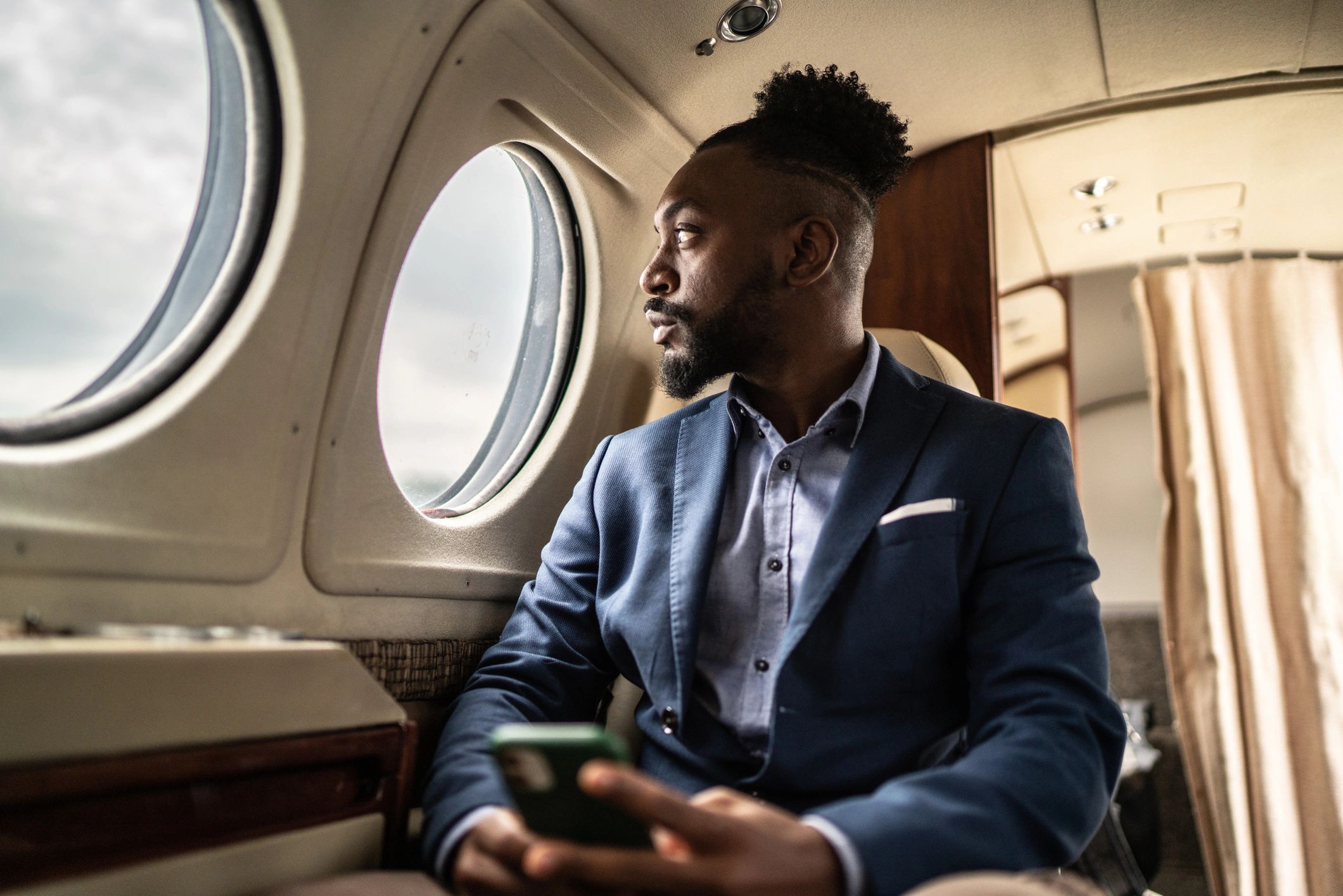 Executive working quietly on a private jet