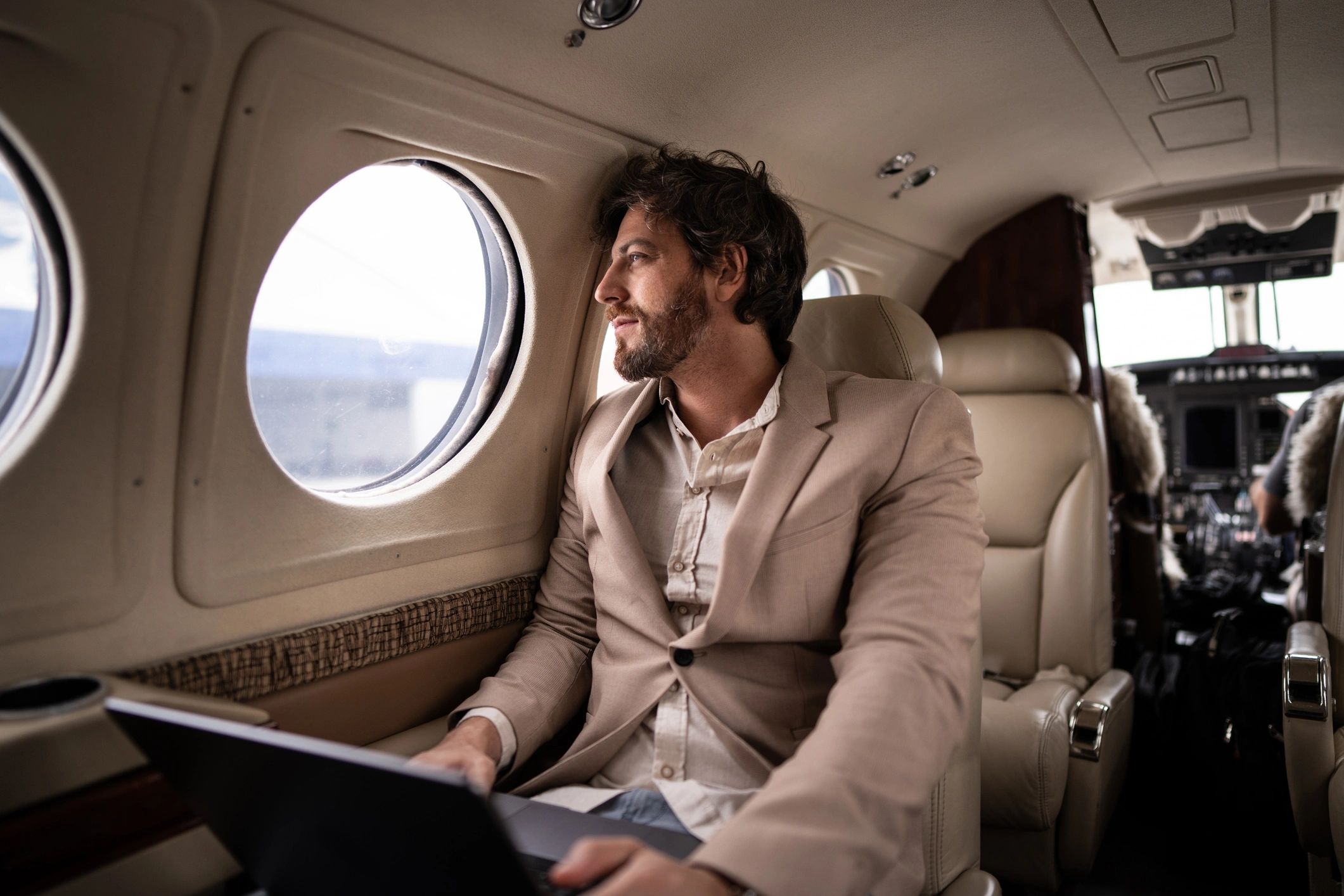 Businessman contemplating quietly on a private jet