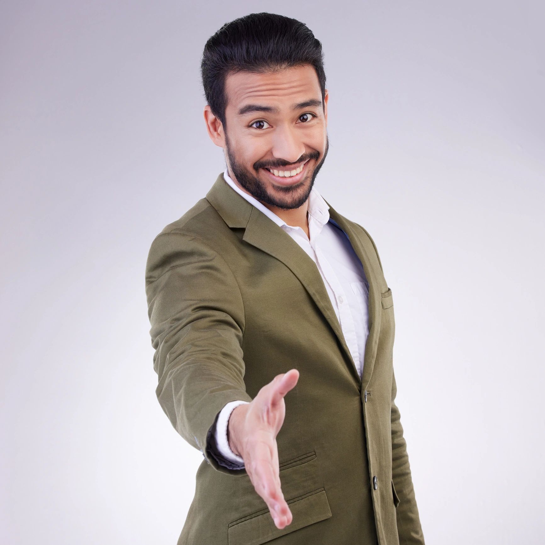 Studio portrait of a business professional offering a handshake