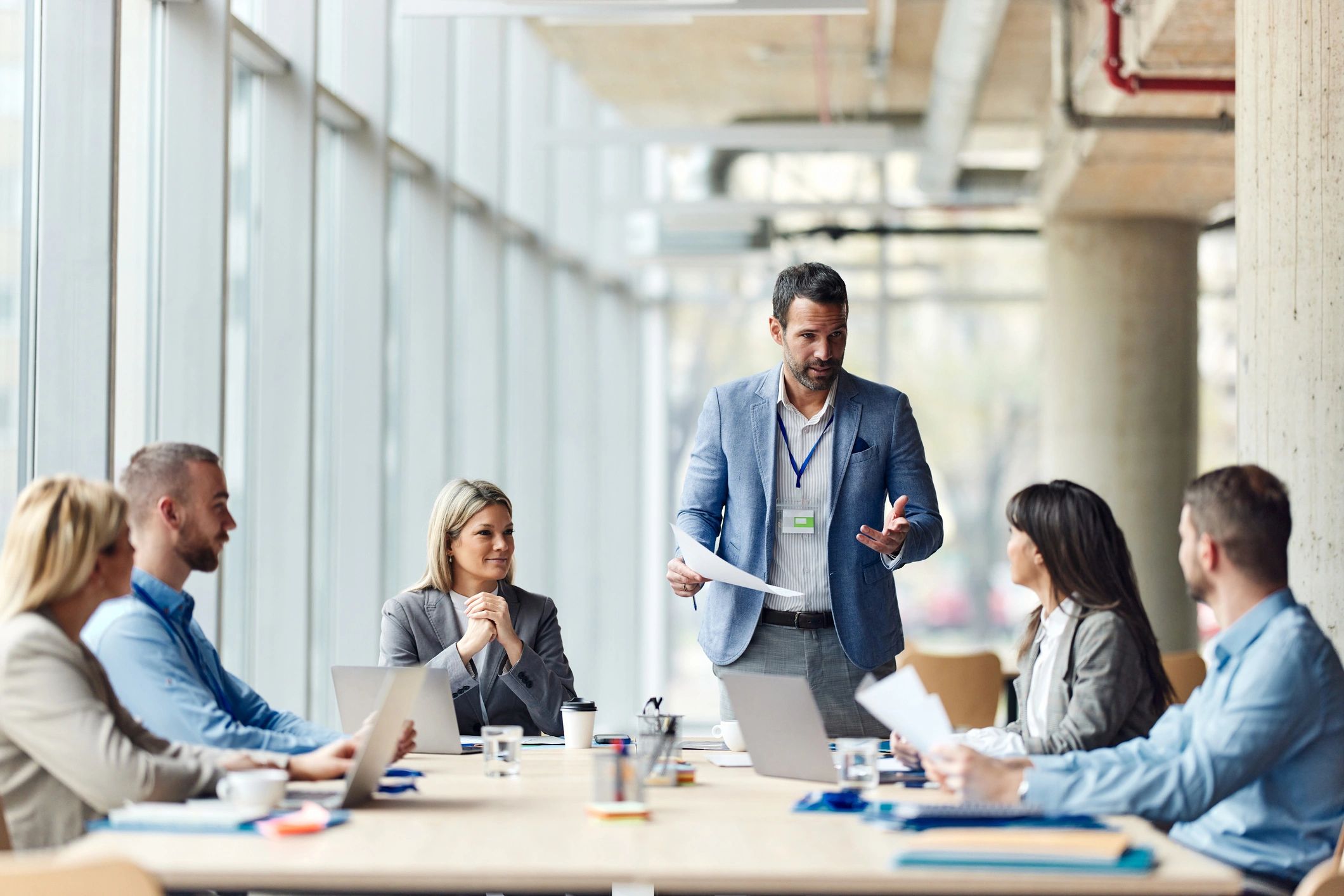 Executive leading a private workshop with a small group