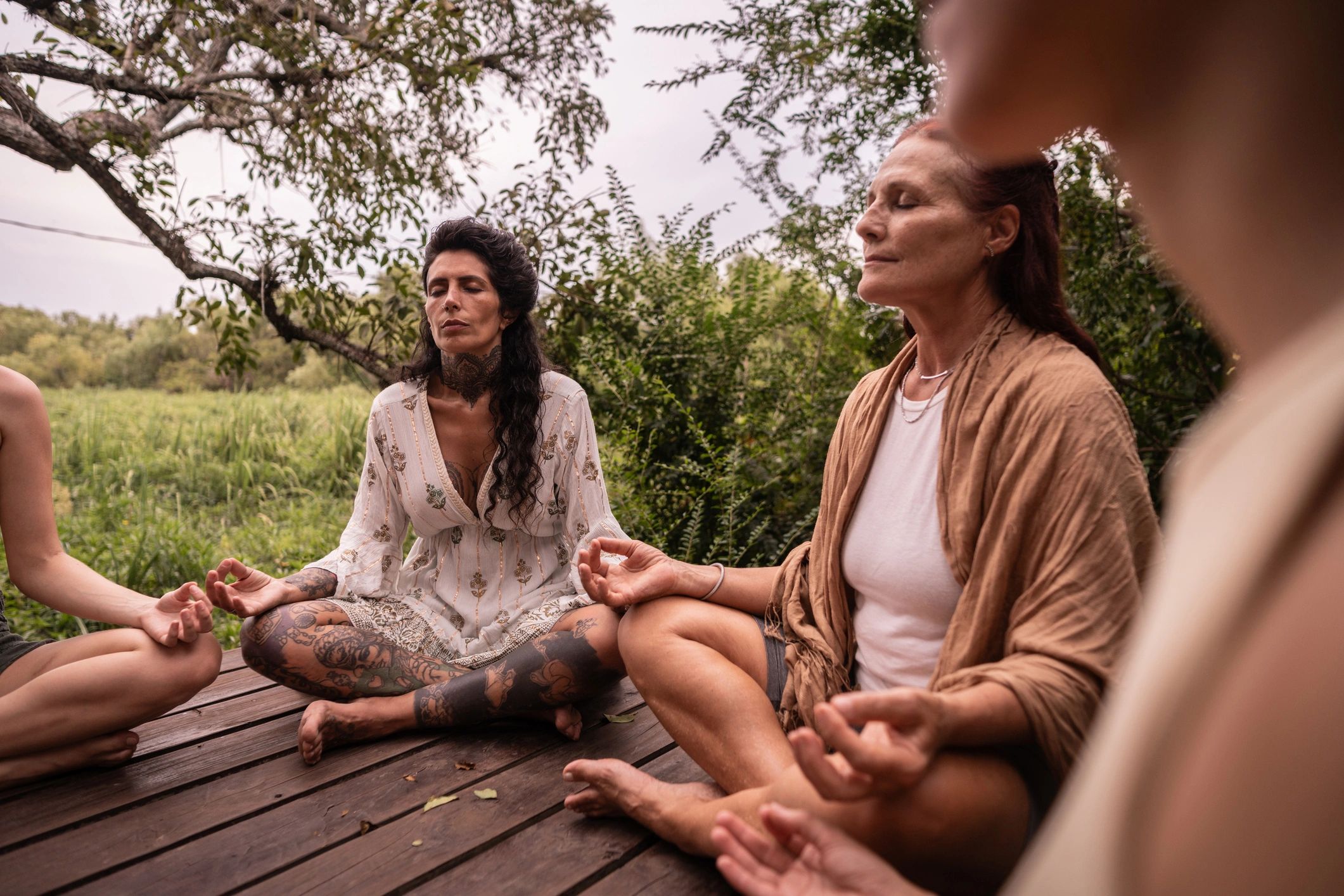 Group practicing yoga outdoors during a retreat