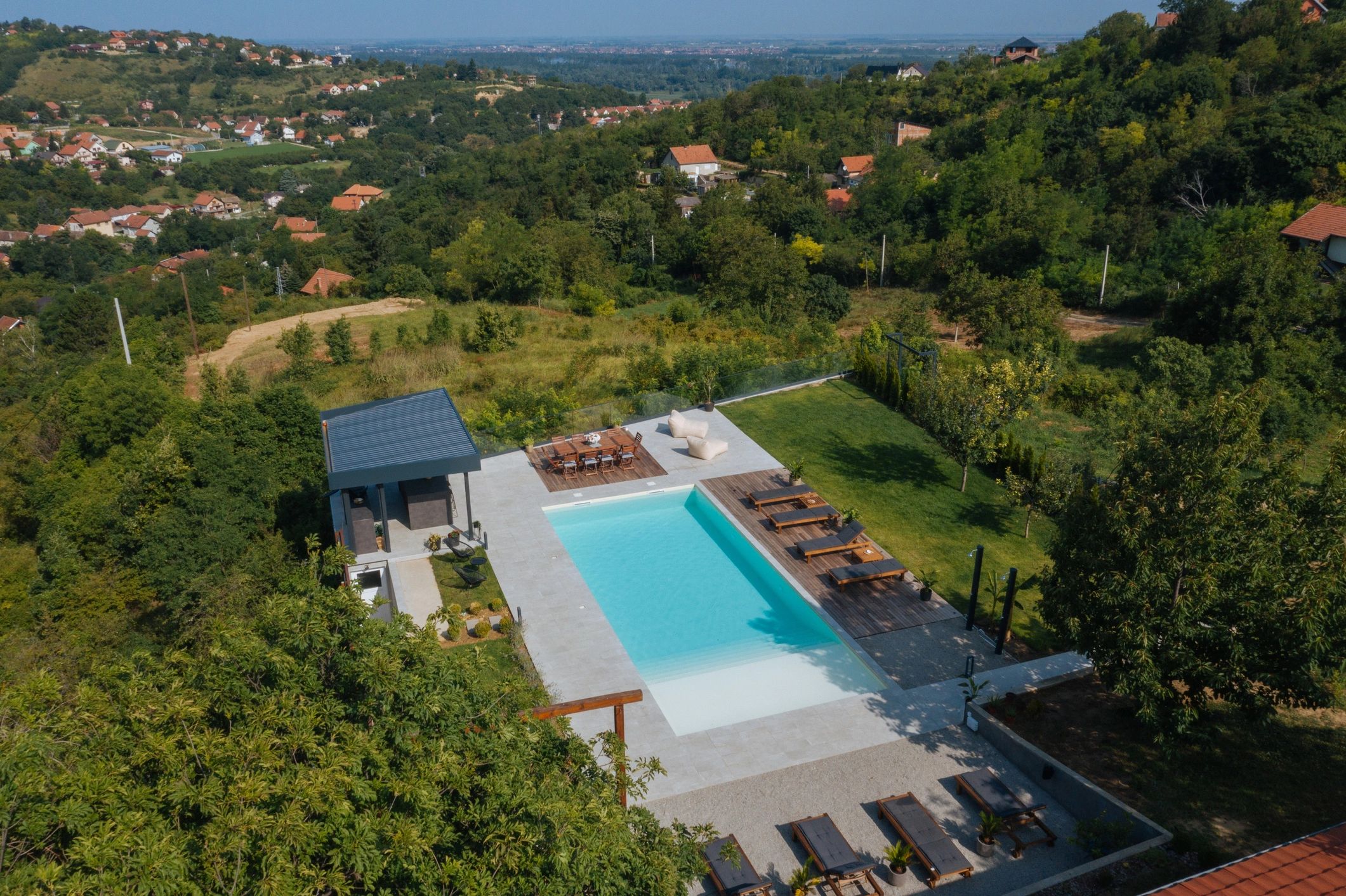 Aerial view of a summer house with pool