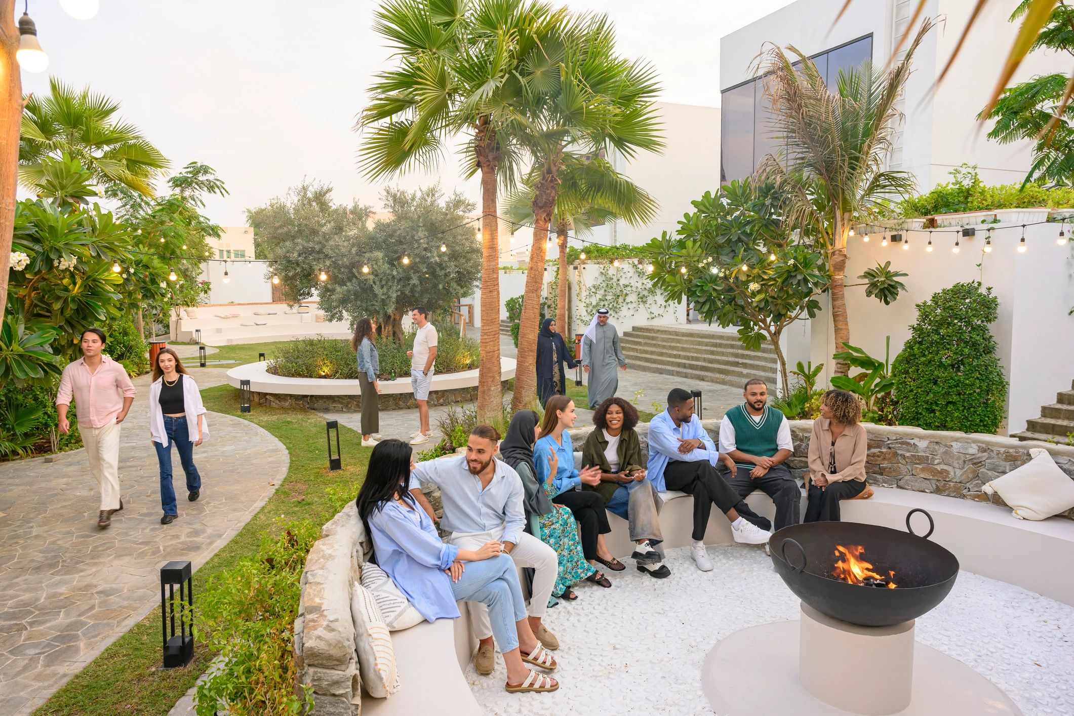 Small group gathering outdoors in an elegant setting for a private experience