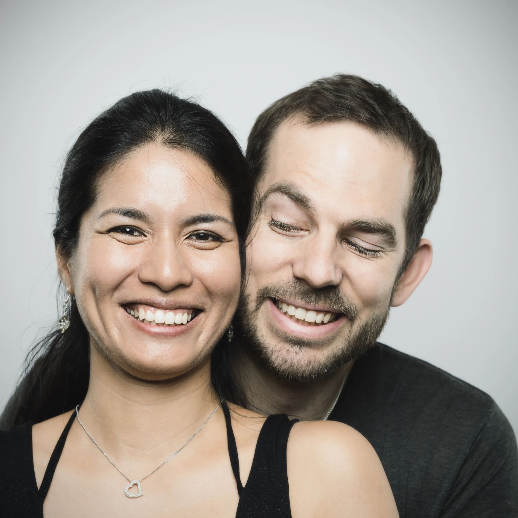 Portrait of a couple smiling in a studio setting
